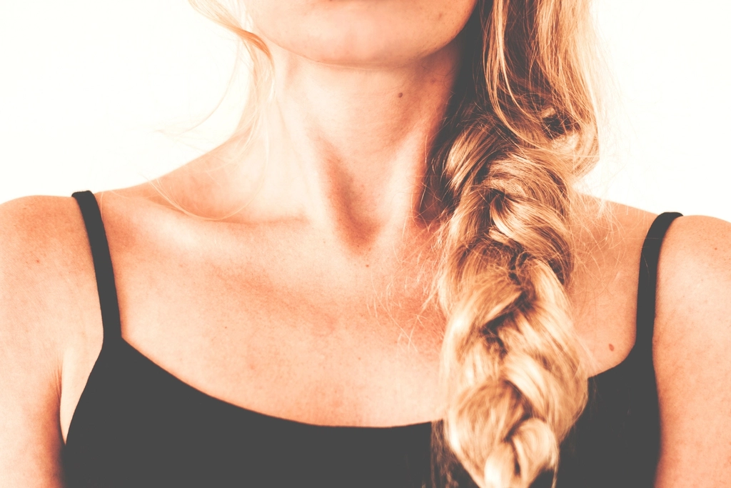 Woman with healthy, cared-for hair — a calm portrait illustrating emotional hair care
